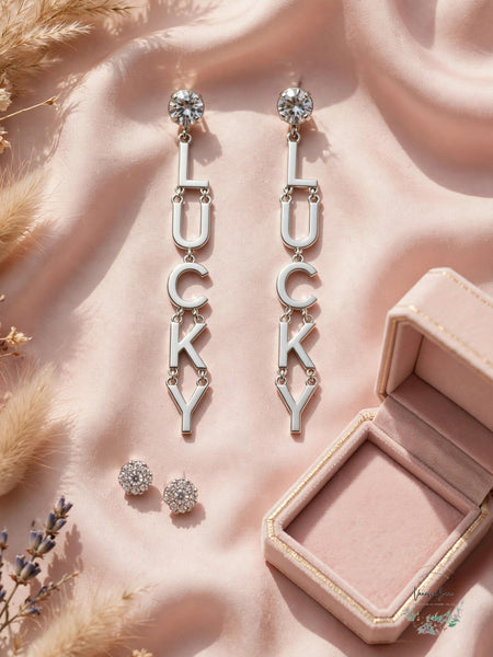 BCBG LUCKY earring set lifestyle flat lay