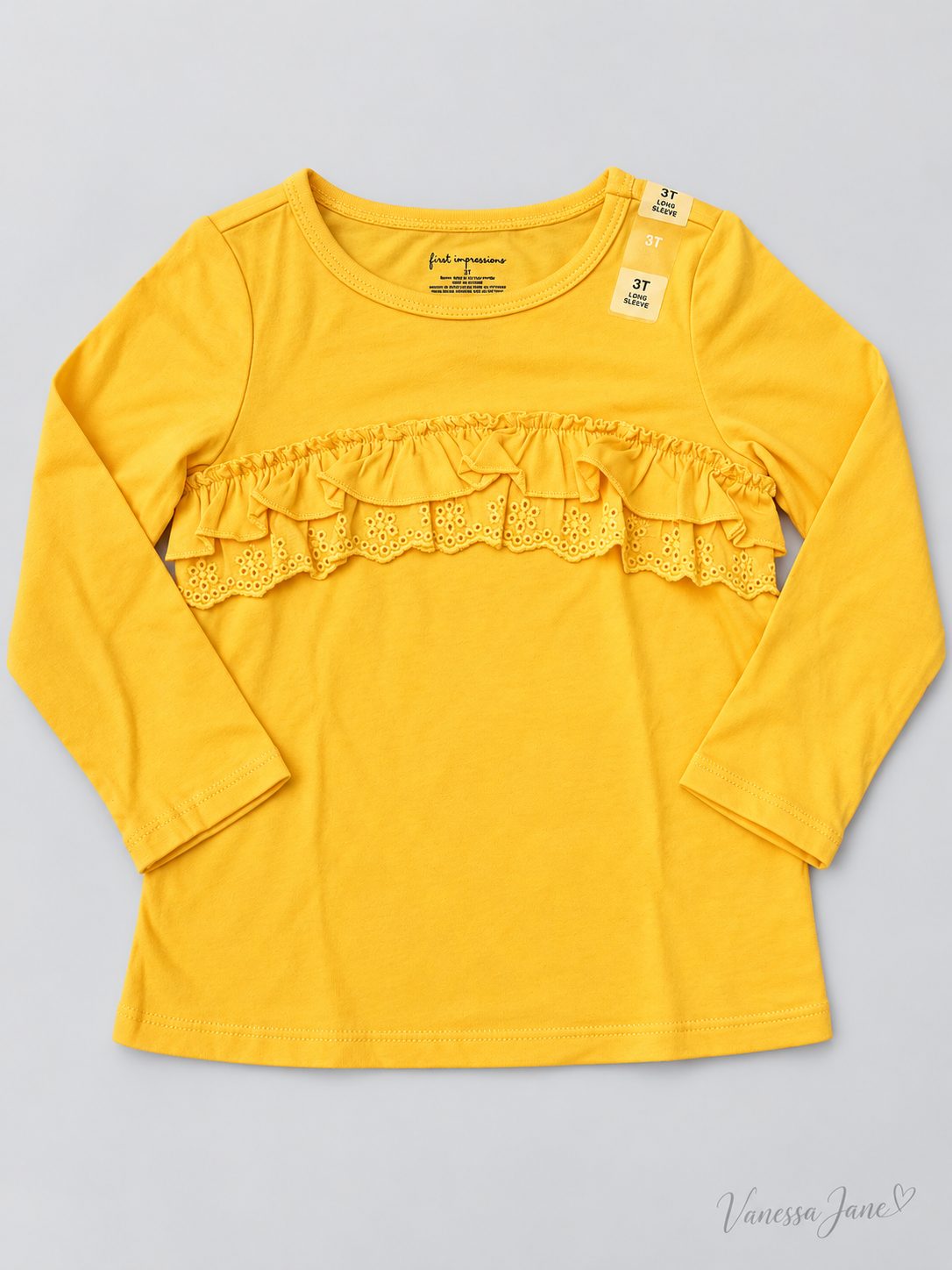 Yellow ruffle long sleeve shirt front